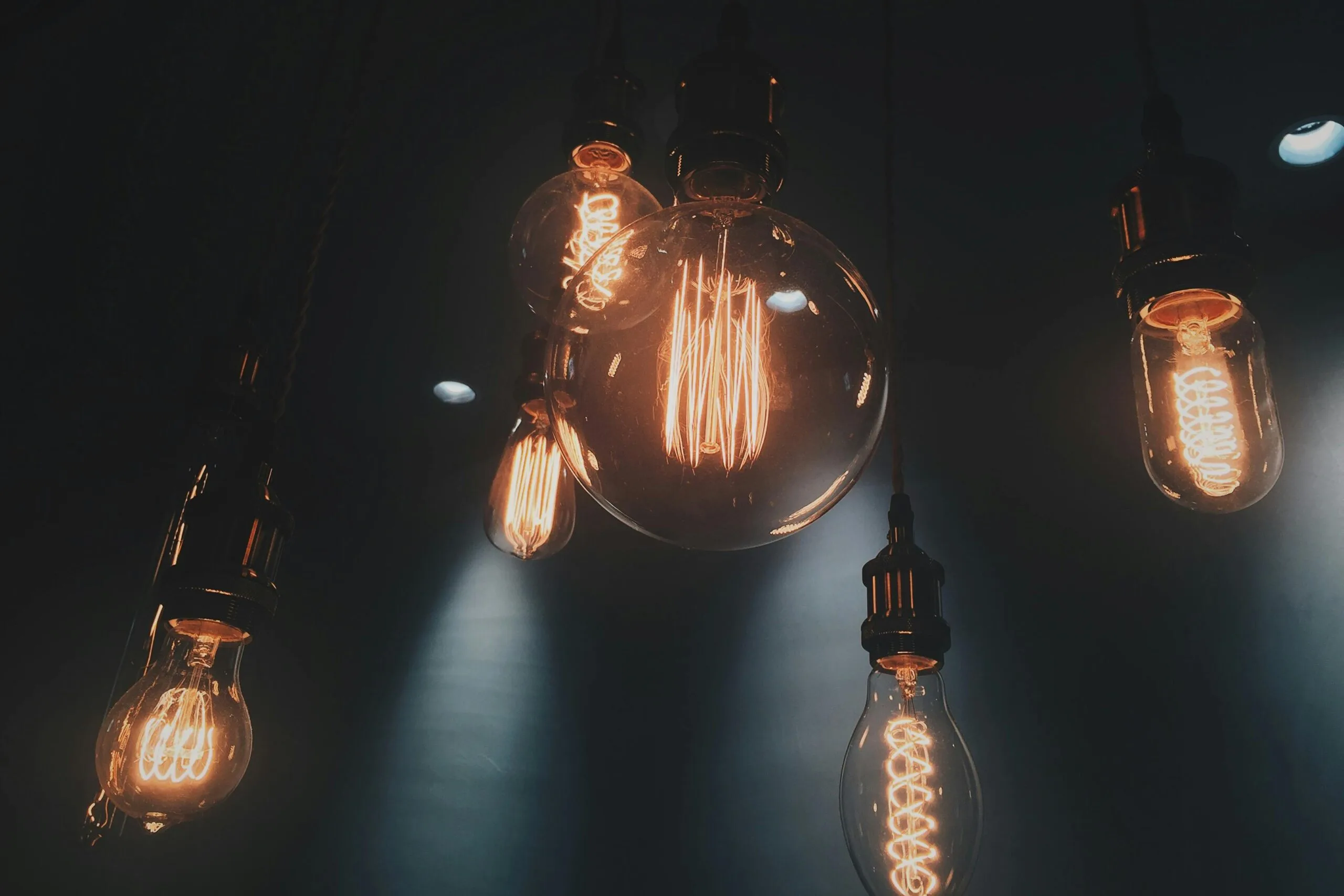 pexels-photo-401107-401107 Close-up of vintage Edison light bulbs glowing warmly in Shinjuku, Tokyo.
